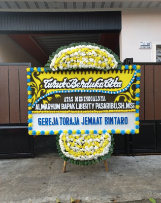 Papan Bunga Duka di Monano